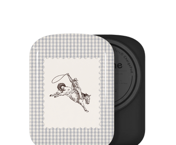 Battery ChargePod, featuring a gray and white gingham border and a central cream panel with a black line drawing of a cowboy riding a galloping horse. A second black square piece is partially visible behind it on a white background.