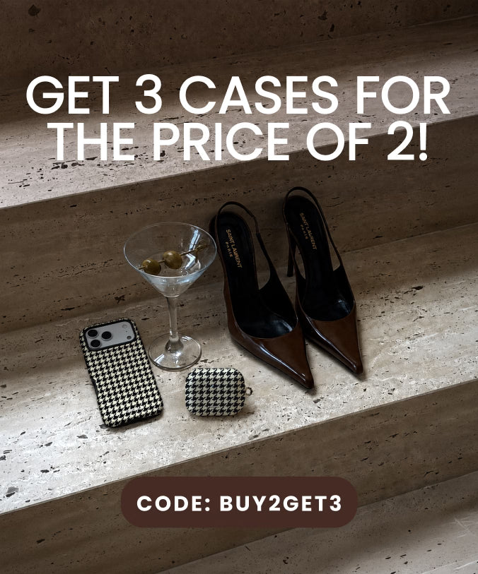 A promotional flat-lay on stone steps showing a black-and-white houndstooth phone case, a small matching houndstooth pouch, and a pair of black pointed slingback heels, with large text reading 'GET 3 CASES FOR THE PRICE OF 2!' and a code banner at the bottom.