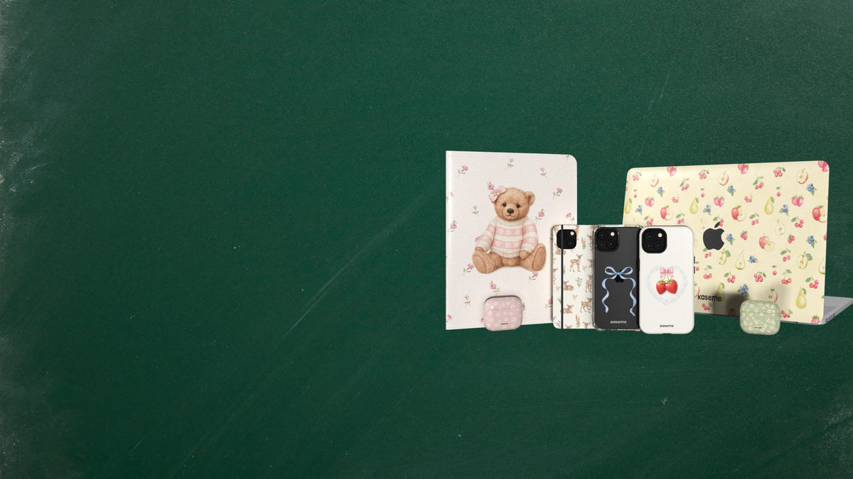 A set of three decorative phone cases displayed on a dark green chalkboard background. The left case features a teddy bear illustration, the middle case has a black and white pattern with a blue bow graphic, and the right case has a multicolor floral print.