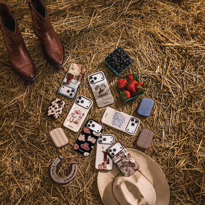 Country cases on a farm background with boots and hat