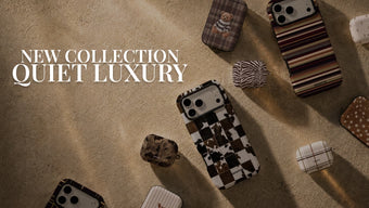 A styled flat-lay of multiple phone cases on a textured beige surface under warm directional light, with large text reading 'NEW COLLECTION QUIET LUXURY' on the left. The cases feature mixed patterns including stripes, plaid, zebra, check, camo, and solid tones in earthy brown, beige, black, and white.